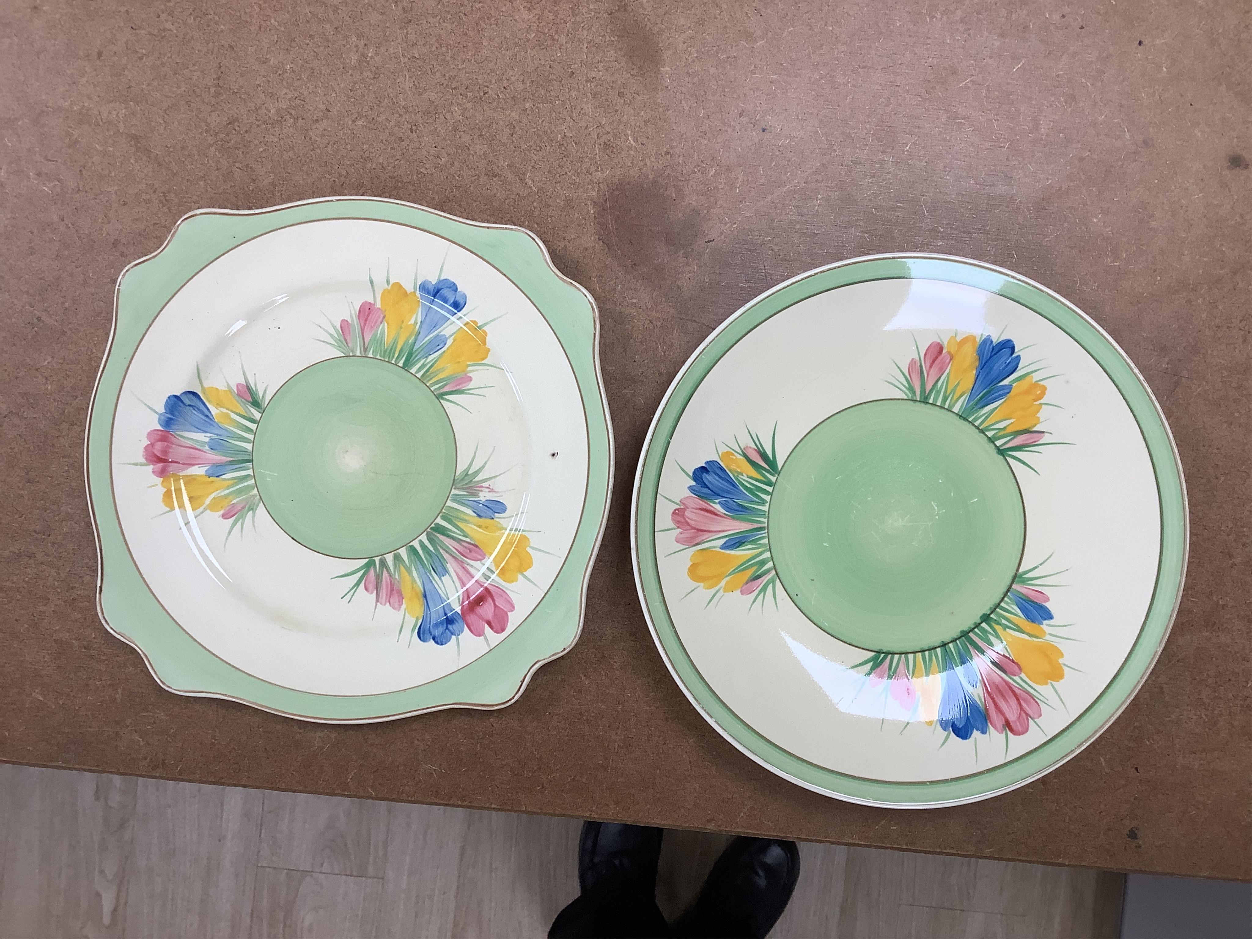 Collection of Clarice Cliff crocus pattern tea wares to include trios, milk jug, and a bowl, largest 22cm in diameter